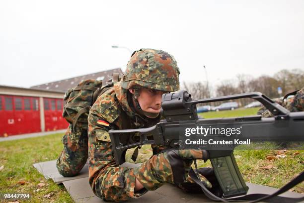 Young recruit of the Bundeswehr guard of honour practices in basic training with the G36 assault rifle at the Julius Leber barracks on April 14, 2010...