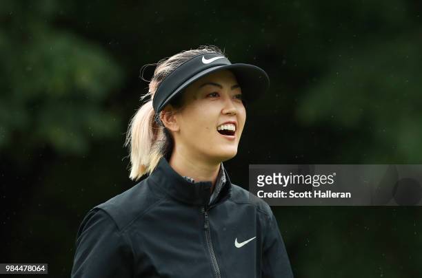 Michelle Wie laughs with her caddie during the pro-am prior to the start of the KPMG Women's PGA Championship at Kemper Lakes Golf Club on June 26,...