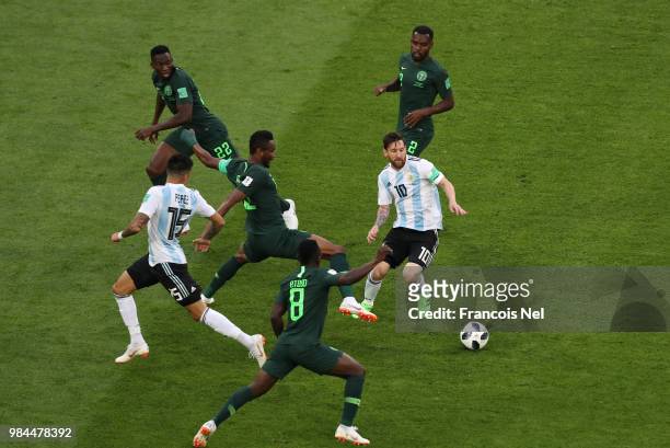 Lionel Messi of Argentina is surrounded by Nigeria players during the 2018 FIFA World Cup Russia group D match between Nigeria and Argentina at Saint...