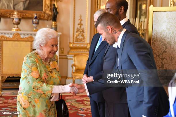 Queen Elizabeth II meets David Beckham at Buckingham Palace on June 26, 2018 in London, England. The Queen's Young Leaders Programme, now in its...