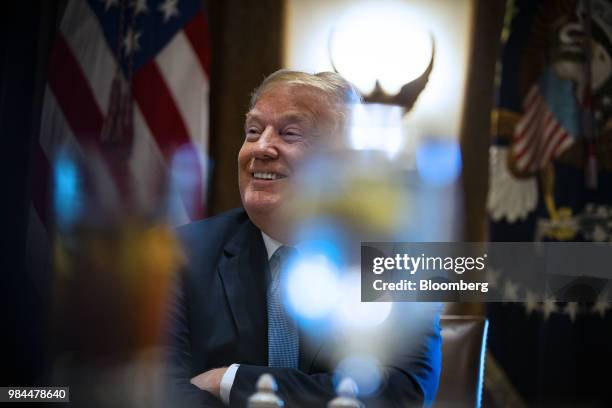 President Donald Trump smiles during a lunch meeting with Republican lawmakers in the Cabinet Room of the White House in Washington, D.C., U.S., on...