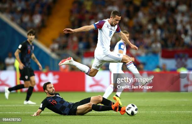 Milan Badelj of Croatia tackles Gylfi Sigurdsson of Iceland during the 2018 FIFA World Cup Russia group D match between Iceland and Croatia at Rostov...