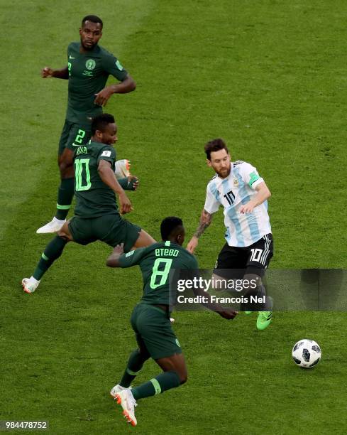 Lionel Messi of Argentina is surrounded by Nigeria players during the 2018 FIFA World Cup Russia group D match between Nigeria and Argentina at Saint...