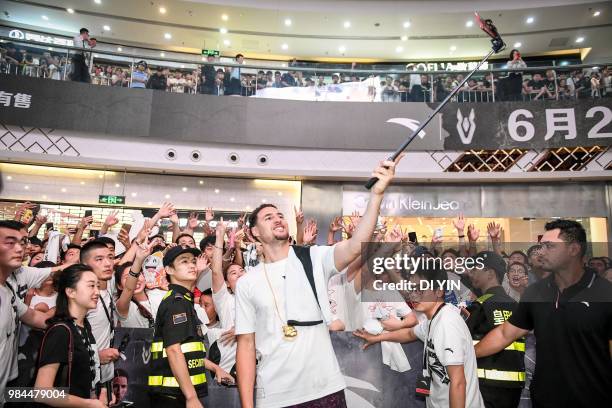 Player Klay Thompson of the Golden State Warriors shoot a selfie in a fans meeting on June 26, 2018 in Zhengzhou, China.