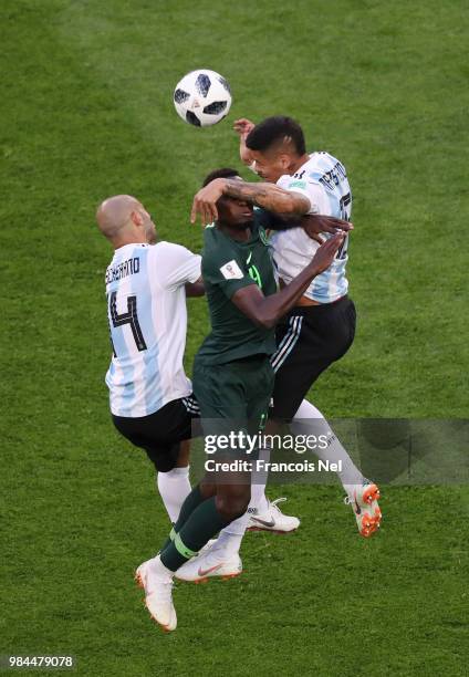 Marcos Rojo of Argentina wins a header over Wilfred Ndidi during the 2018 FIFA World Cup Russia group D match between Nigeria and Argentina at Saint...