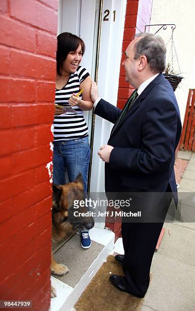 Leader Alex Salmond and SNP candidate John Mason meet with constituents on the campaign trail on April 14, 2010 in Glasgow, Scotland. The General...