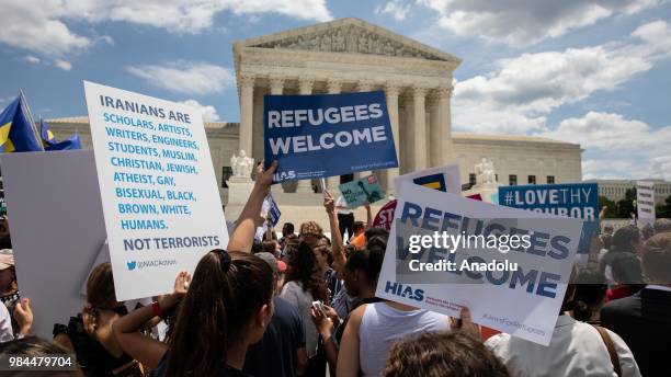 People protest the Muslim travel ban outside of the US Supreme Court in Washington, USA on June 26, 2018.