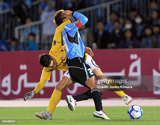 Hiroyuki Taniguchi of Kawasaki Frontale and Molina of Seongnam Ilhwa compete for the ball during the AFC Champions League match between Kawasaki...