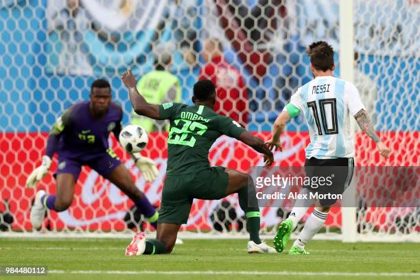 Lionel Messi of Argentina scores his team's first goal during the 2018 FIFA World Cup Russia group D match between Nigeria and Argentina at Saint...