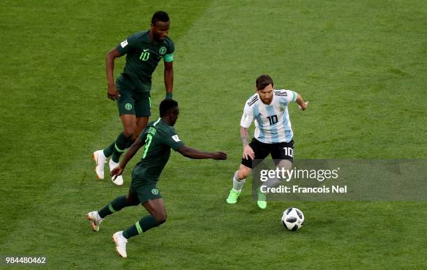 Lionel Messi of Argentina is challenged by John Obi Mikel and Oghenekaro Etebo of Nigeria during the 2018 FIFA World Cup Russia group D match between...