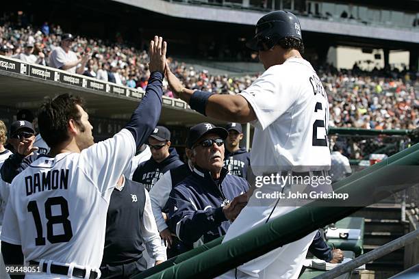 Manager Jim Leyland and Johnny Damon congratulate Miguel Cabrera of the Detroit Tigers during the game against the Cleveland Indians on Saturday,...