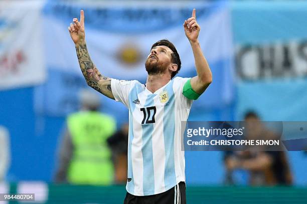 Argentina's forward Lionel Messi celebrates after opening the scoring during the Russia 2018 World Cup Group D football match between Nigeria and...