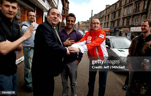 Leader Alex Salmond and SNP candidate John Mason meet with constituents on the campaign trail on April 14, 2010 in Glasgow, Scotland. The General...