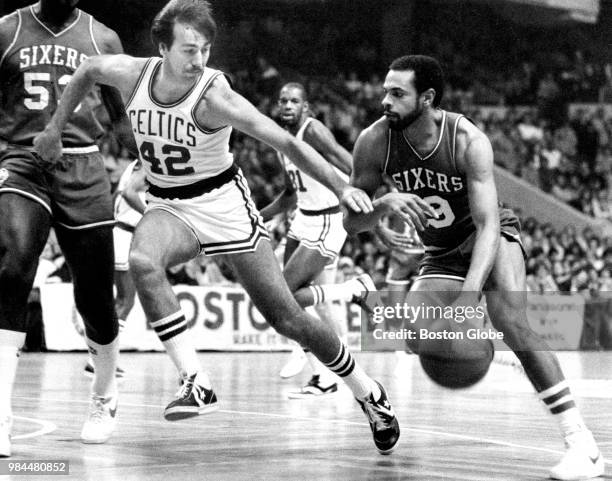 Philadelphia 76ers' Lionel Hollins, right, dribbles the ball as the Celtics' Chris Ford guards at left. The Boston Celtics host the Philadelphia...