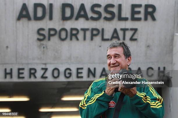 Head coach Carlos Alberto Gomes Parreira takes pictures during a training session of the South African national football team on April 14, 2010 in...