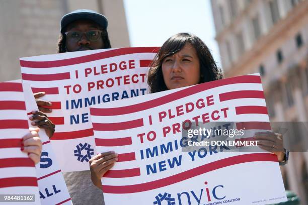 Members of the New York Immigration Coalition hold a news conference in Foley Square, to talk about the US Supreme Court decision to uphold US...