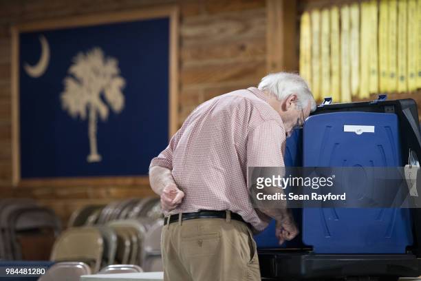 Residents cast their votes during a primary election at an American Legion Hall on June 26, 2018 in Cayce, South Carolina. The most notable race is a...