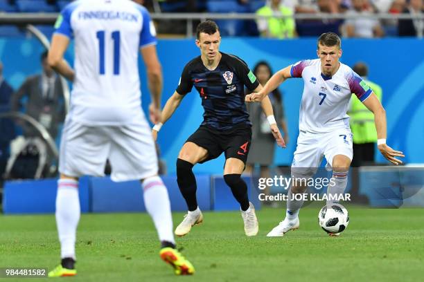 Croatia's forward Ivan Perisic vies with Iceland's midfielder Johann Gudmundsson during the Russia 2018 World Cup Group D football match between...