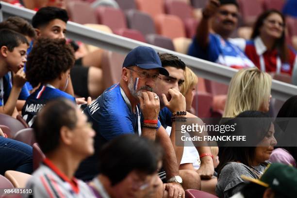 France's forward Antoine Griezmann's father, Alain, and his brother, Theo, are pictured in the stands before the Russia 2018 World Cup Group C...