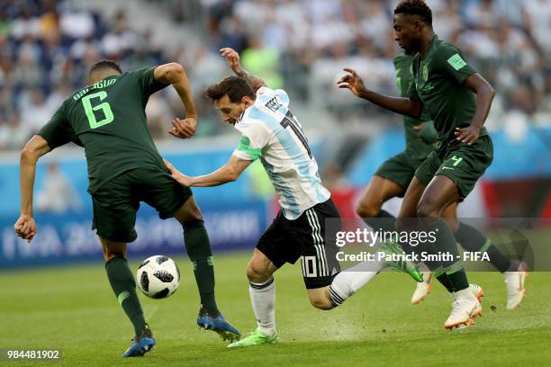 Lionel Messi of Argentina is challenged by Wilfred Ndidi and Leon Balogun of Nigeria during the 2018 FIFA World Cup Russia group D match between...