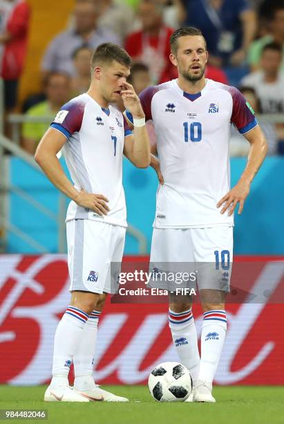 Gylfi Sigurdsson talks with Johann Gudmundsson of Iceland during the 2018 FIFA World Cup Russia group D match between Iceland and Croatia at Rostov...