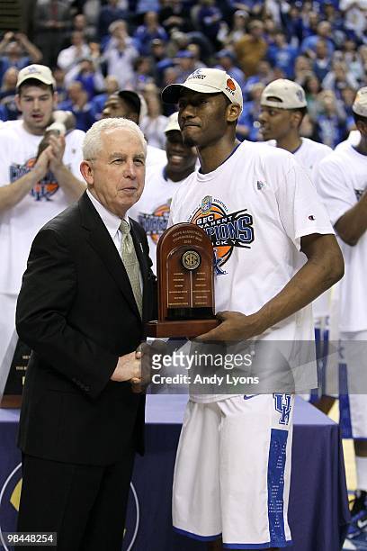 John Wall of the Kentucky Wildcats receives the tournament MVP trophy after Kentucy won 75-74 in overtime against the Mississippi State Bulldogs...