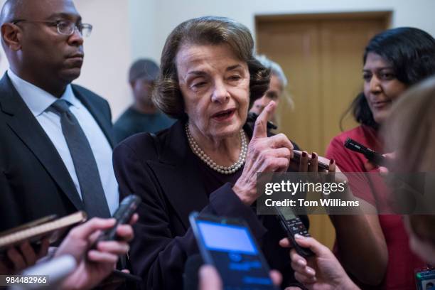 Sen. Dianne Feinstein, D-Calif., talks with reporters before the Senate Policy luncheons in the Capitol on June 26, 2018.