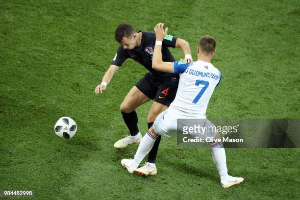 Ivan Perisic of Croatia is challenged by Johann Gudmundsson of Iceland during the 2018 FIFA World Cup Russia group D match between Iceland and...