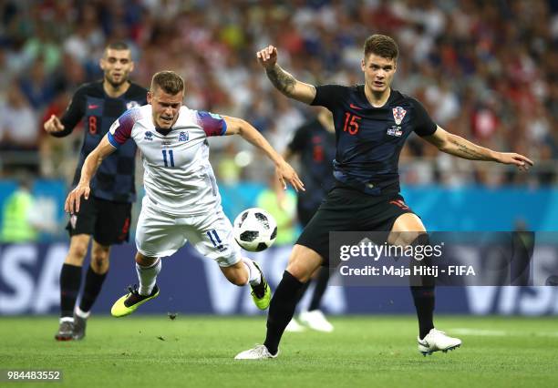 Alfred Finnbogason of Iceland is challenged by Duje Caleta-Car of Croatia during the 2018 FIFA World Cup Russia group D match between Iceland and...