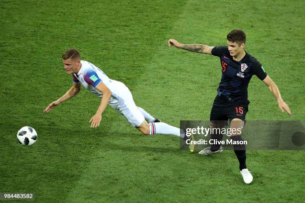 Alfred Finnbogason of Iceland is challenged by Duje Caleta-Car of Croatia during the 2018 FIFA World Cup Russia group D match between Iceland and...