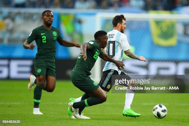 Lionel Messi of Argentina competes with Kenneth Omeruo of Nigeria during the 2018 FIFA World Cup Russia group D match between Nigeria and Argentina...