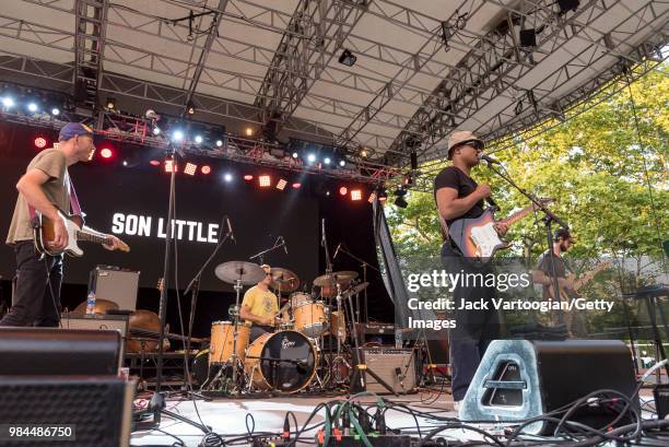American blues and rhythm & blues singer-songwriter Son Little performs with his band with Pat Finnerty on guitar, Jesse Maynard on drums, and...