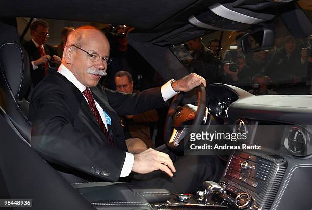 Dieter Zetsche, CEO of Daimler AG, sits in a Mercedes SLS car, at the company's annual shareholder's meeting at Messe Berlin on April 14, 2010 in...