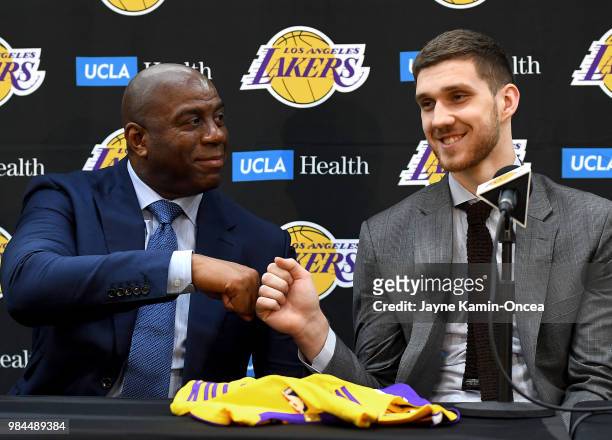 The Los Angeles Lakers 2018 draft pick Moritz Wagner gets a fist pump from president of basketball operations Magic Johnson during a press conference...