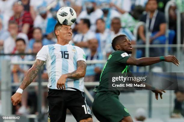 Marcos Rojo of Argentina national team and Kelechi Iheanacho of Nigeria national team vie for a header during the 2018 FIFA World Cup Russia group D...