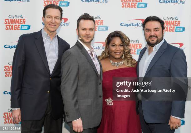 American pianist Dan Saunders, Canadian baritone Joshua Hopkins, American soprano Latonia Moore, and Guatemalan tenor Mario Chang pose backstage for...