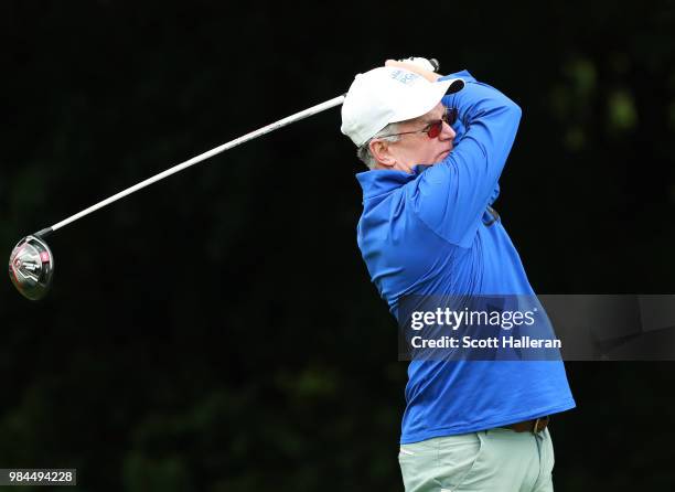 John Veihmeyer of KPMG watches a tee shot during the pro-am prior to the start of the KPMG Women's PGA Championship at Kemper Lakes Golf Club on June...