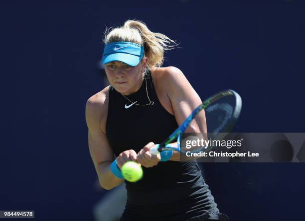 Carina Witthoeft of Germany in action against Pauline Parmentier of France celebrates in their Round One match during Day One of the Fuzion 100...