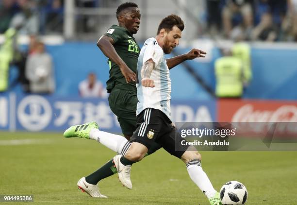 Messi of Argentina in action against Kenneth Omeruo of Nigeria during the 2018 FIFA World Cup Russia Group D match between Nigeria and Argentina at...