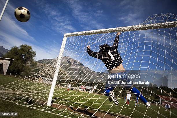 The goalie for Azul Unido blocks a shot on goal by O'Higgins during a soccer match on March 28, 2010 in Futaleufu, Chile. Soccer matches between...