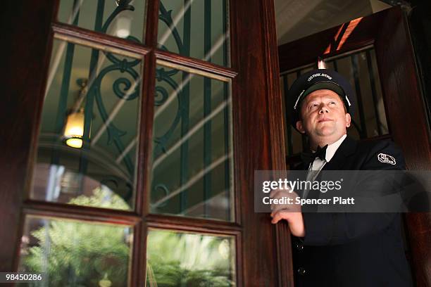 Doorman, who preferred not to be identified, stands outside of his building on the Upper East Side of Manhattan on April 14, 2010 in New York City....