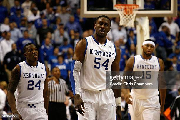 Eric Bledsoe, Patrick Patterson and DeMarcus Cousins of the Kentucky Wildcats walk up court against the Mississippi State Bulldogs during the final...