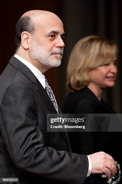 Ben S. Bernanke, chairman of the U.S. Federal Reserve, left, arrives with Representative Carolyn Maloney, a Democrat from New York, at a Joint...