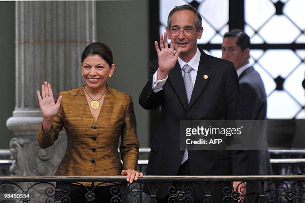 Costa Rican president elect Laura Chinchilla and Guatemalan President Alvaro Colom wave at the Palacio de la Cultura in Guatemala City, on April 13,...