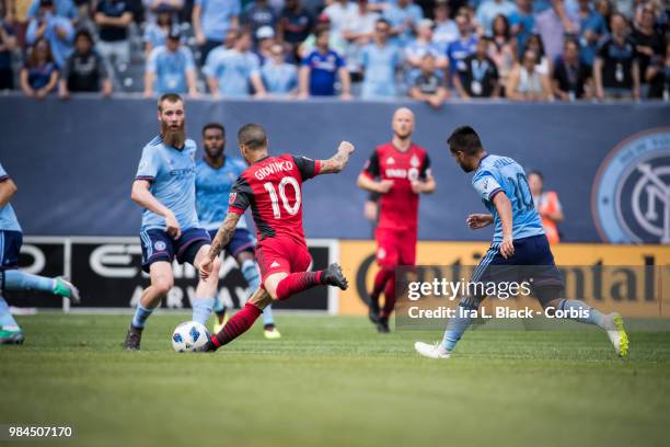 Sebastian Giovinco of Toronto FC goes for the shot on goal during the MLS match between New York City FC and Toronto FC at Yankee Stadium on June 24,...