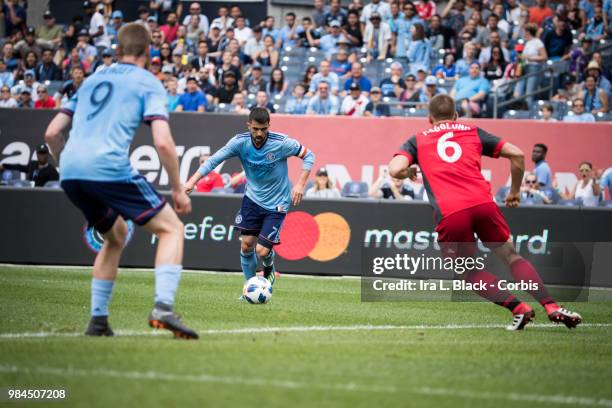 David Villa of New York City eyes the shot on goal during the MLS match between New York City FC and Toronto FC at Yankee Stadium on June 24, 2018 in...