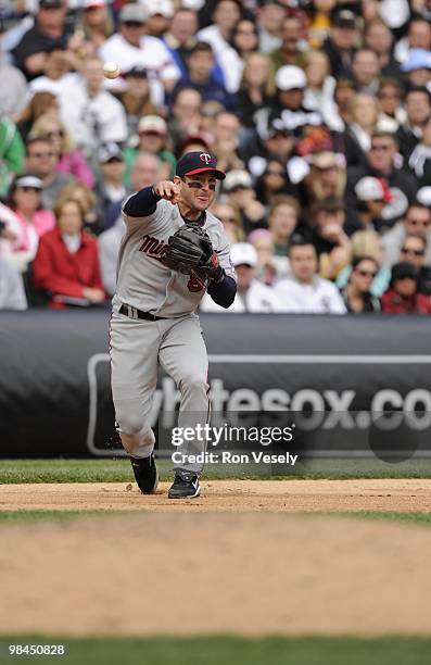 Nick Punto of the Minnesota Twins throws the ball during the game between the Minnesota Twins and the Chicago White Sox on Sunday, April 11 at U.S....