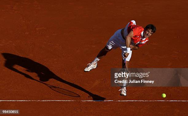 Tommy Robredo of Spain serves with partner Marcel Granollers of Spain in their doubles match against Jo-Wilfried Tsonga of France and Richard Gasquet...