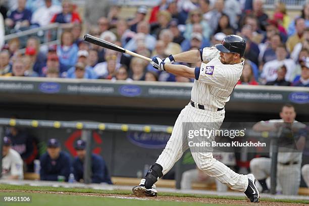 April 12: Jason Kubel of the Minnesota Twins hits the first home run ever at Target Field against the Boston Red Sox on April 12, 2010 in...