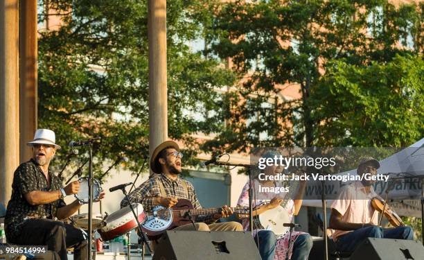 The Carolina Chocolate Drops with, from left, guest Sule Greg Wilson on tambourine, Dom Flemons on resonator guitar, Rhiannon Giddens on banjo, and...